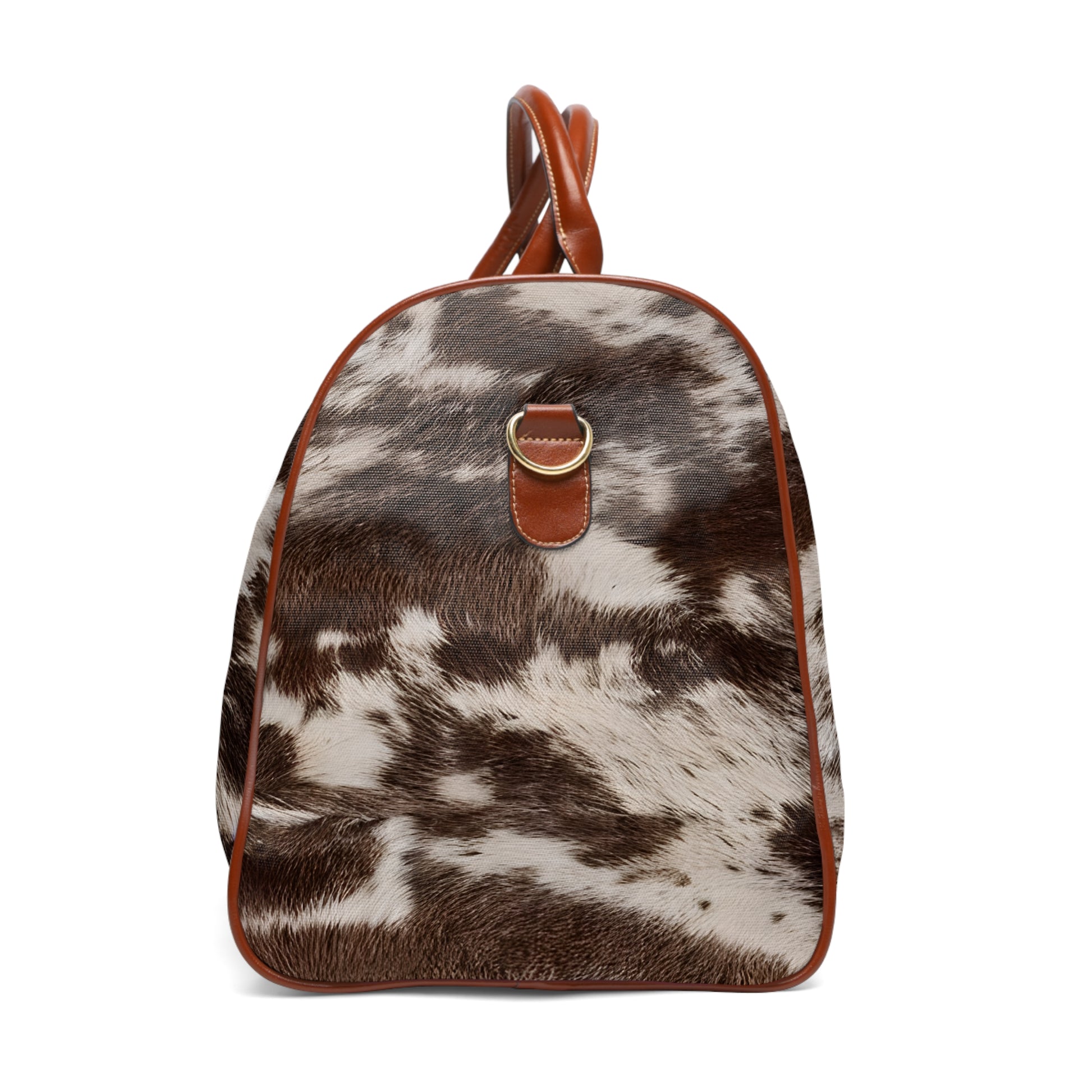 Cow Print Weekender Bag from Texas Diamond D Farms. Designed for the modern traveler with a love for unique, Western-inspired style, this bag features a striking cow print that makes it a standout piece.