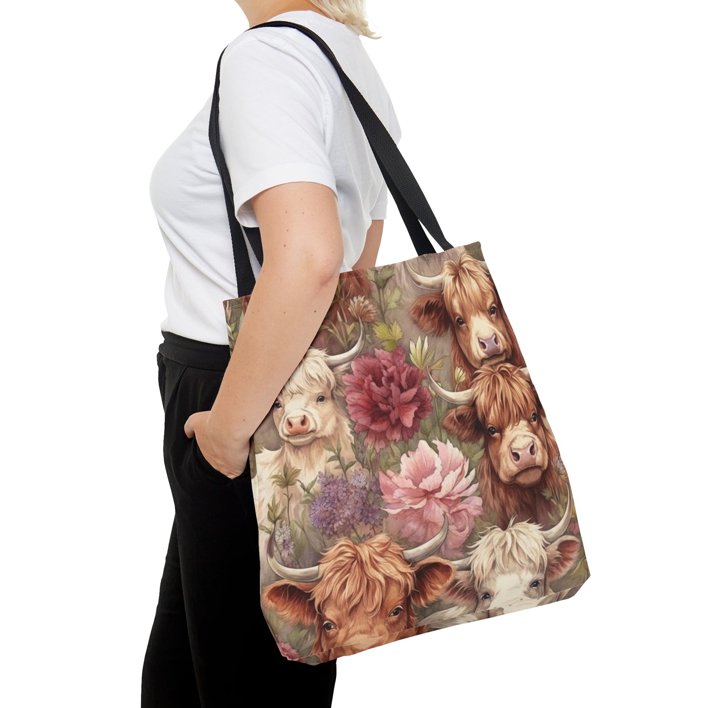 Highland Majesty Meets Floral Elegance: Immerse yourself in the rustic charm of Highland Cows surrounded by blooming beauty. Our tote bag seamlessly blends the regal presence of Highland cattle with the delicate allure of floral artistry.&nbsp;