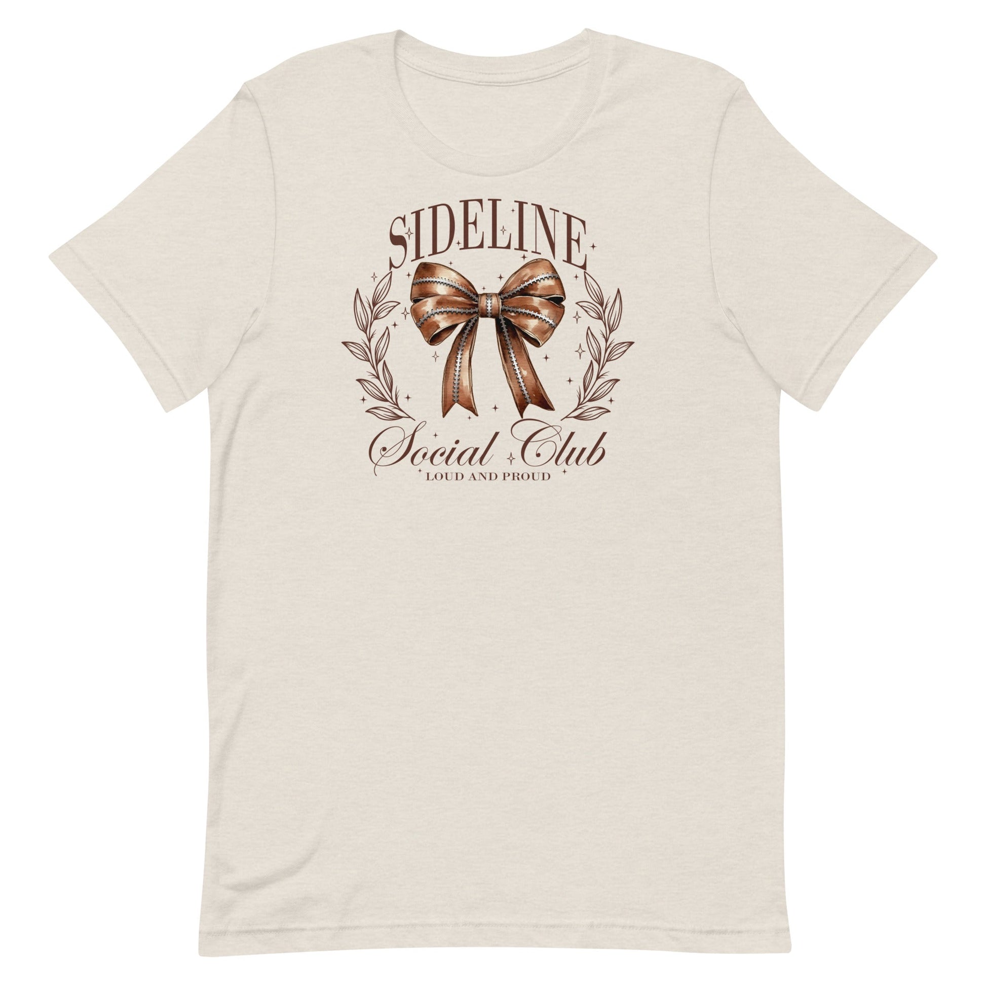 Step up your game day style with our Sideline Social Club t-shirt! This fashionable tee features a bold football-themed bow at its center, surrounded by the empowering text "Sideline Social Club" and "Loud and Proud." Perfect for those who support their team with passion and flair, this shirt is designed for the ultimate fan who loves to cheer from the sidelines in style.