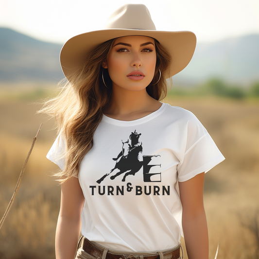 Rev up your rodeo style with our 'Turn and Burn' Barrel Racer T-shirt! Inspired by the adrenaline-fueled world of barrel racing, this tee captures the heart-pounding excitement of each tight turn and lightning-fast run. Crafted from premium materials for comfort and durability, it's perfect for both riders and rodeo enthusiasts alike. Whether you're hitting the arena or cheering from the sidelines, let your passion for the sport shine with our 'Turn and Burn' T-shirt.